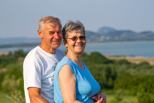 Happy elderly seniors couple in outdoors