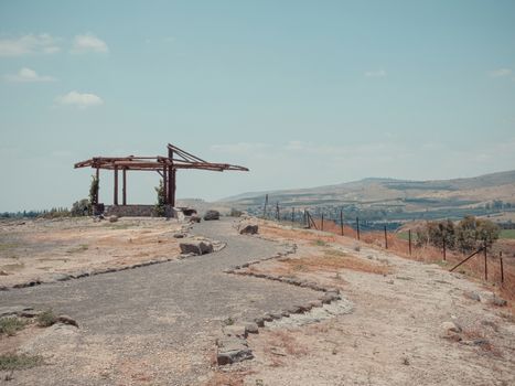 Lookout with panoramic view of the landscape of the country area of Jordan Valley in northern Israel. A tourist destination of the rural and nature area with the Jordan River and agricultural fields.