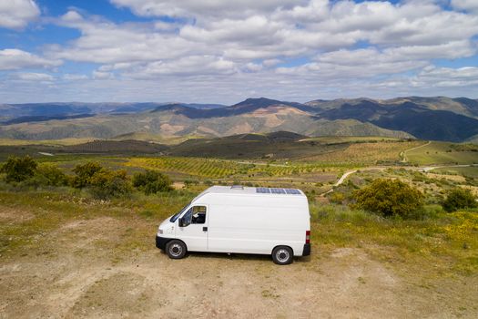 Landscape drone aerial view of a van social distancing vanlife in miradouro de Sao Gabriel viewpoint, Portugal