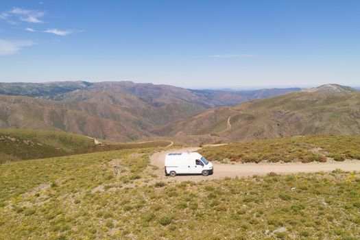 Serra da Freita drone aerial view of a camper van in Arouca Geopark on a road, in Portugal