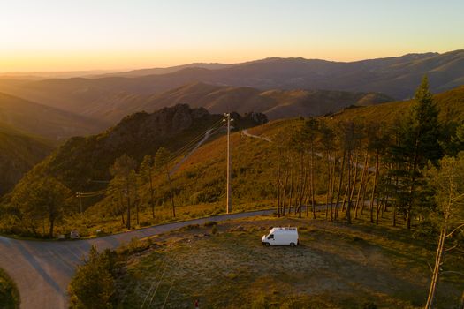 Serra da Freita drone aerial view of a camper van in Arouca Geopark at sunset, in Portugal