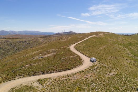 Serra da Freita drone aerial view of a camper van in Arouca Geopark on a road, in Portugal