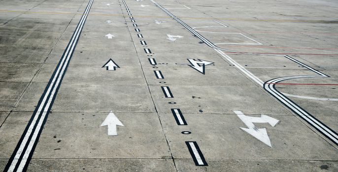 Aged Kathmandu airport runway with direction signs