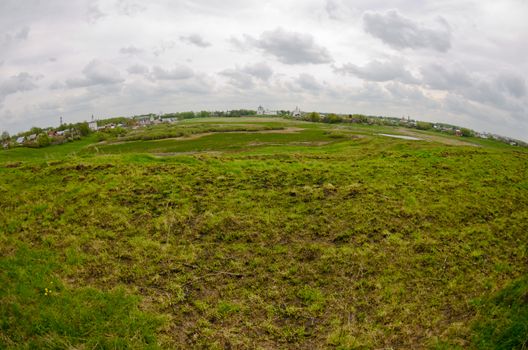 Fisheye view of the ancient Russian town Suzdal under the cloudy sky