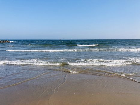 Beautiful view of seashore with sea waves during the summer season