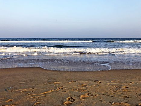 Beautiful view of seashore with sea waves during the summer season
