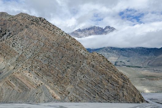 Clearly visible layered geological structure of Nepalese mountain near Jomsom town. Nepal.