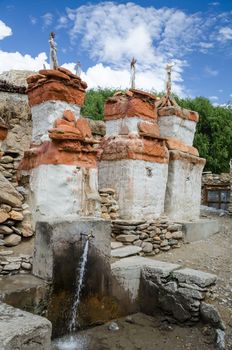 Chortens and flowing water at water supply system of Chele village, Upper Mustang