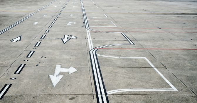 Aged Kathmandu airport runway with direction signs