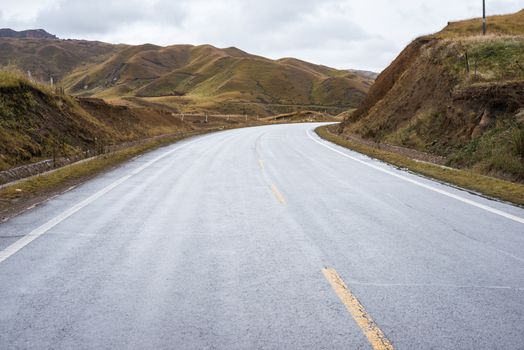 The road across meadows of upper Tibet region