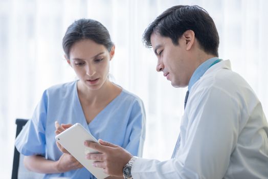 A doctor take care of sick patient woman at the hospital or medical clinic.