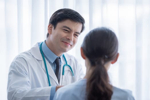 A doctor take care of sick patient woman at the hospital or medical clinic.