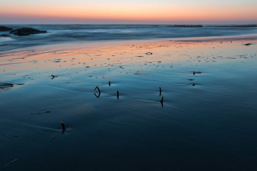 A colorful sunset at Atlantic Ocean Coast near Namib Desert