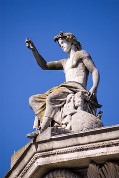 Statue of the ancient Greek god Apollo on the pediment above the famous Ashmolean Museum in Oxford, England.