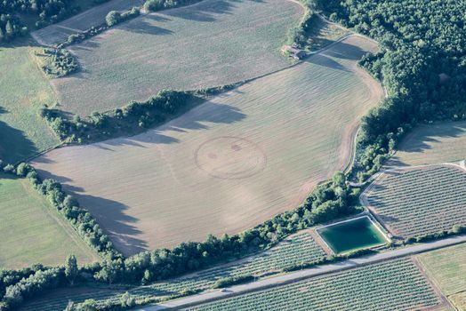 Humorous smiley emoticon on a harvested green field of Provence, France