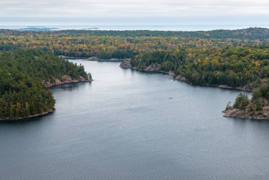 Beautiful view of a fall forest and George Lake from the mountain top, Killarney, Canada