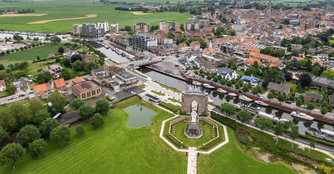 Diksmuide, Flanders, Belgium -  June 19, 2019: View on White Crypt memorial, remnants of dynamited tower, and city from up IJzertoren, tallest peace monument of WW 1.