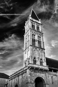 Tower of medieval cathedral in the town of Trogir in Croatia, black and white