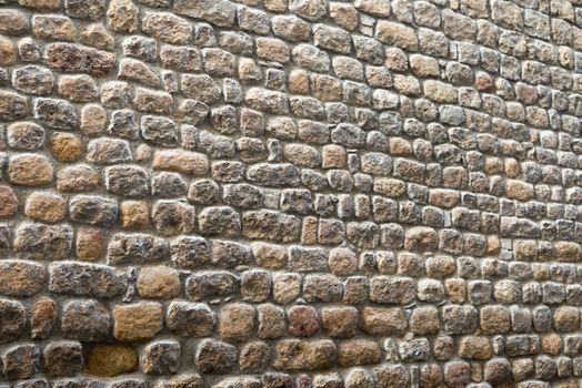 Biased ancient stone wall of a historical building, suitable as a textured background