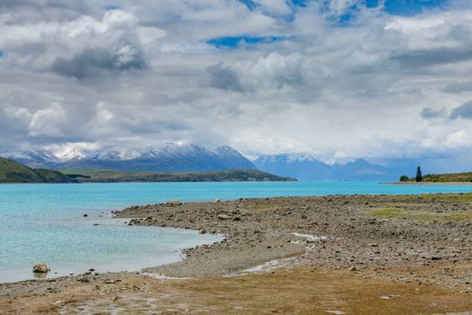 Impressive water colour and mountain landscape at the Tekapo Lake, New Zealand