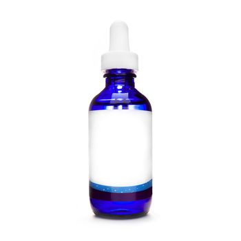 blue bottle with pipette. dropper bottle with serum. cosmetic oil on white background. essential oils isolated. natural oil bottle. container