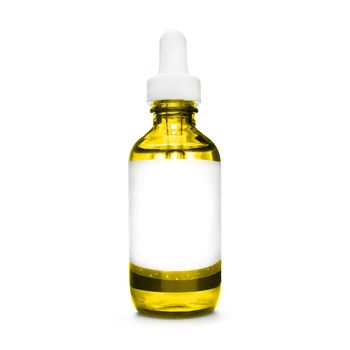yellow bottle with pipette. dropper bottle with serum. cosmetic oil on white background. essential oils isolated. natural oil bottle. container