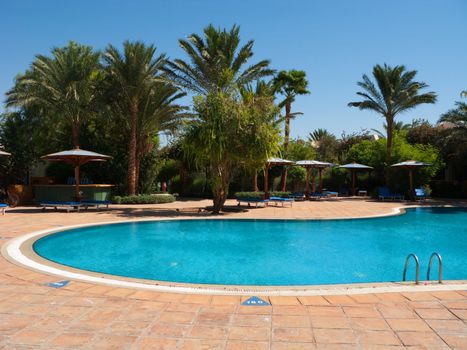 General view of the hotel pool under the blue Egypt sky