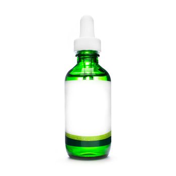 green bottle with pipette. dropper bottle with serum. cosmetic oil on white background. essential oils isolated. natural oil bottle. container