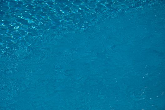 Just the clear water in a hotel swimming pool with some visible ripples