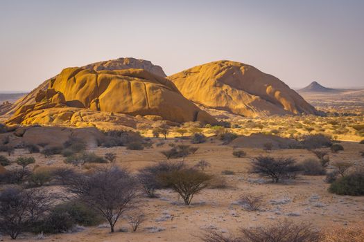 The Pondoks near the Spitzkoppe mountain at sunset in Namibia in Africa.