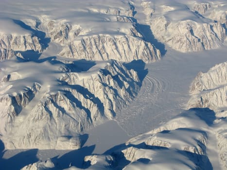 Aerial view of the Greenland with glacier, mountains and rocks