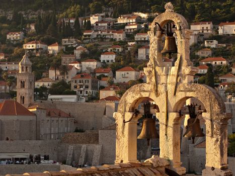 The belfry at Dubrovnik city center, surrounded by red town's roofs. Croatia.