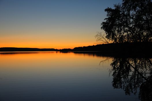 The final stage of a sunset above the huge lake in Karelia region