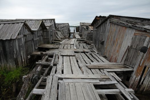 The picture shows abandoned and broken slip docs in a small settlement in Russia's Karelia region