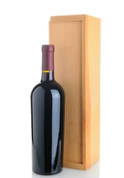 A Cabernet Sauvignon wine bottle standing in front of a wood box. Isolated on white with reflection.