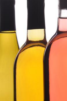 Abstract Close up of Three Different Wine Bottles on white background vertical format