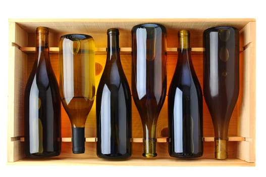 Six bottles of Chardonnay wine in a wooden case, view from above over a white background.