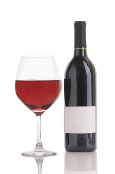 Glass of Red Wine and Bottle isolated on white. Vertical format with reflection.