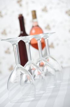 Four Wineglasses and Two Wine Bottles on Tablecloth - with Shallow Depth of Field