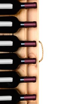 Wine crate with six bottles without labels. Horizontal format on white with copy space.
