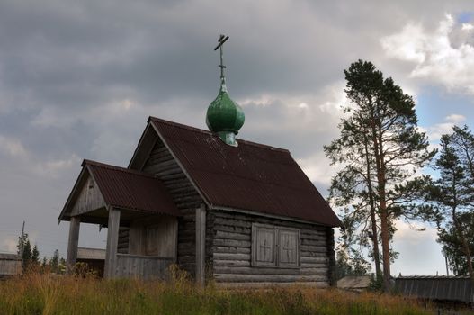 This is the picture of the old rural Russian christian church on a hill