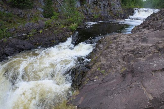 This picture shows Kivach - the most powerfull waterfall in Karelia region (approximately 12 meters)