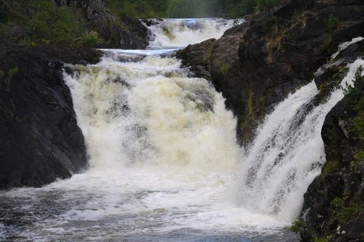 This picture shows Kivach - the most powerfull waterfall in Karelia region (approximately 12 meters)