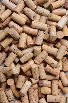 Closeup of a pile of used wine corks. Horizontal format with the corks filling the frame.