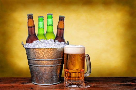 An ice bucket with three green beer bottles next to a full mug of ale on a wet wood surface. Horizontal format with warm mottled background.