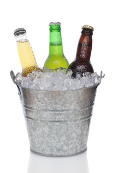 Three Different Beer Bottles in bucket of ice with condensation vertical composition over white background 