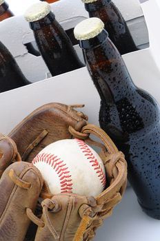 Closeup of a Six Pack of Beer and Baseball Glove. Vertical Format with shallow depth of field.