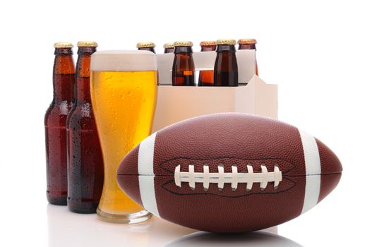Six pack of beer and frothy glass with an American Football in front. Horizontal format isolated on white with reflection.