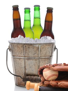 Closeup of an old fashioned beer bucket with three green bottles of cold beer and an American Football. Isolated on white with reflection.