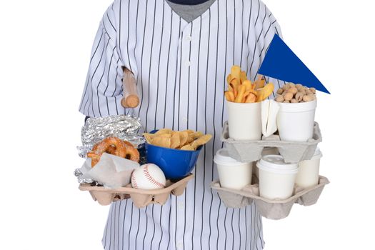Closeup of a sports fan carrying souvenirs and food trays in both hands. Food tray had hot dogs, peanut,s pretzels, chips and french fries. Souvenirs include pennant, baseball, mini bats and helmet.